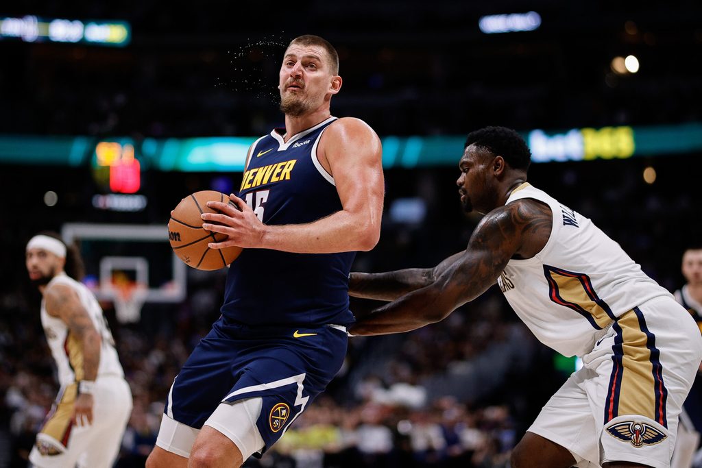 Oct 29, 2025; Denver, Colorado, USA; Denver Nuggets center Nikola Jokic (15) controls the ball under pressure form New Orleans Pelicans forward Zion Williamson (1) in the third quarter at Ball Arena. Mandatory Credit: Isaiah J. Downing-Imagn Images