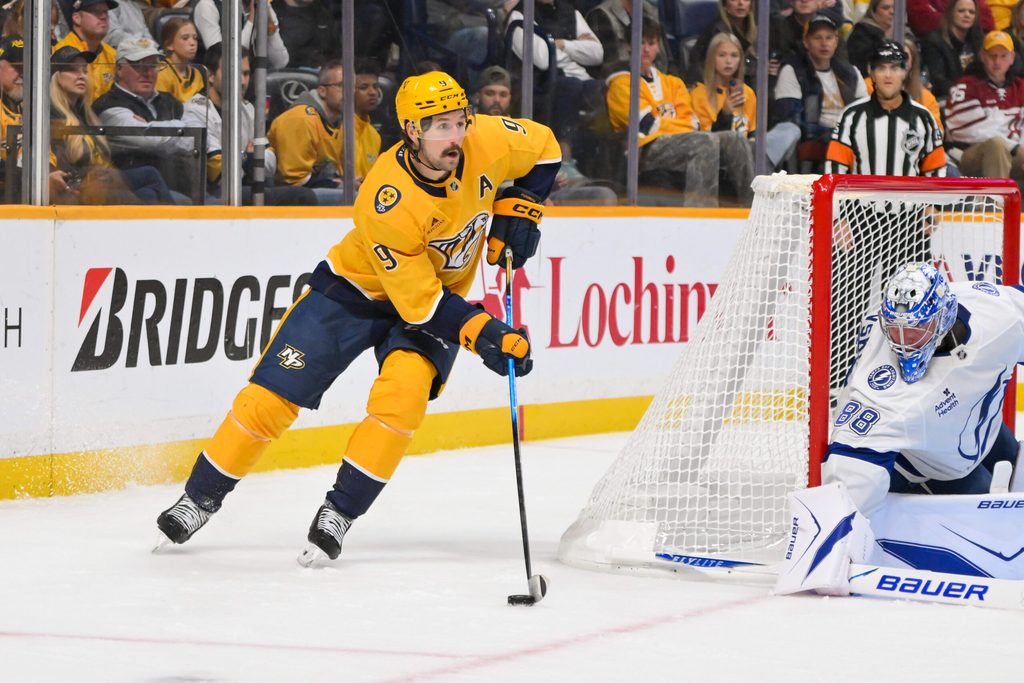 Oct 28, 2025; Nashville, Tennessee, USA; Nashville Predators left wing Filip Forsberg (9) skates behind the net against the Tampa Bay Lightning during the third period at Bridgestone Arena. Mandatory Credit: Steve Roberts-Imagn Images