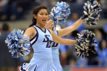 Nov 30, 2017; San Diego, CA, USA; San Diego Toreros cheerleaders perform during a pause in play during the second half of the game between the Toreros and the San Diego State Aztecs at Jenny Craig Pavilion. Mandatory Credit: Orlando Ramirez-Imagn Images