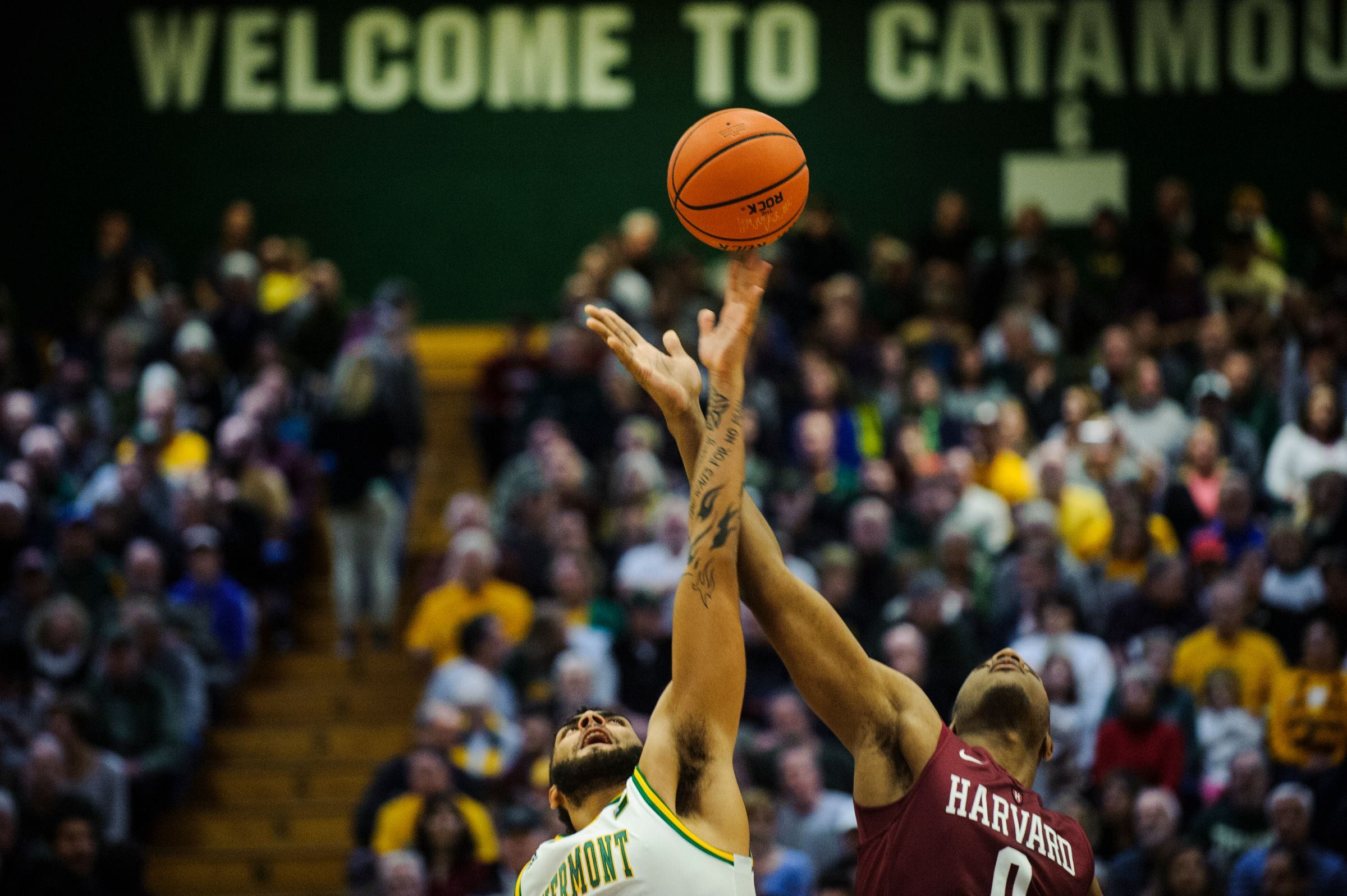Vermont forward Anthony Lamb (3) and Harvard's Chris Lewis (0) battle for the opening tip off during the men's basketball between the Harvard Crimson and the Vermont Catamounts at Patrick Gym on Saturday night December 8, 2018 in Burlington.

Harvard Vs Vermont Men S Basketball 12 8 18