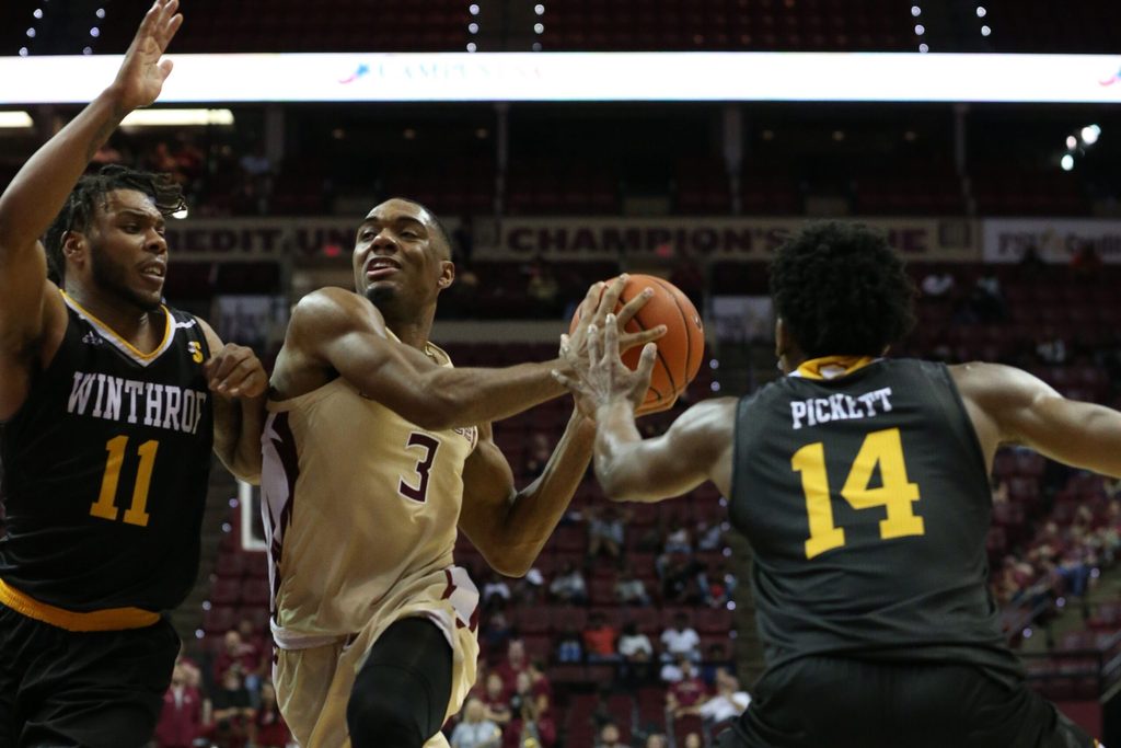 Florida State Seminoles guard Trent Forrest (3) drives the ball to the hoop while Winthrop Eagles guard Charles Falden (11) and Winthrop Eagles guard Adam Pickett (14) try to stop him from scoring. The Florida State Seminoles host the Winthrop Eagles for men's basketball at the Tucker Civic Center, Tuesday, Jan. 1, 2019.
Fsu V Winthrop321