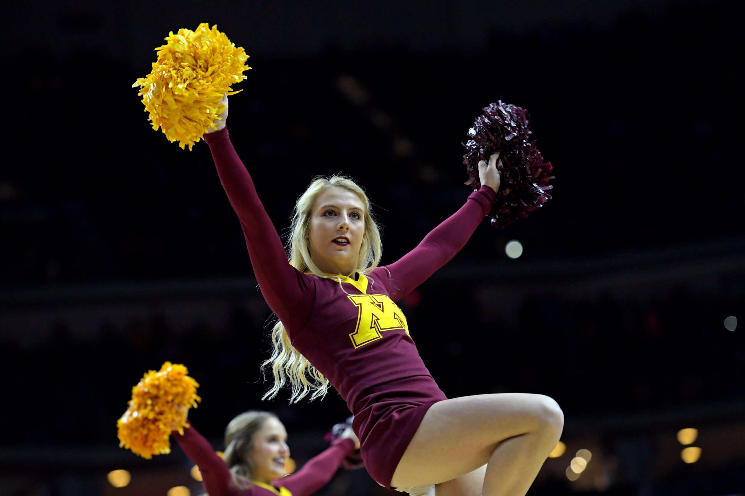 Mar 21, 2019; Des Moines, IA, United States; The Minnesota Golden Gophers cheerleaders on the court before the game against the Louisville Cardinals in the first round of the 2019 NCAA Tournament at Wells Fargo Arena. Mandatory Credit: Steven Branscombe-Imagn Images