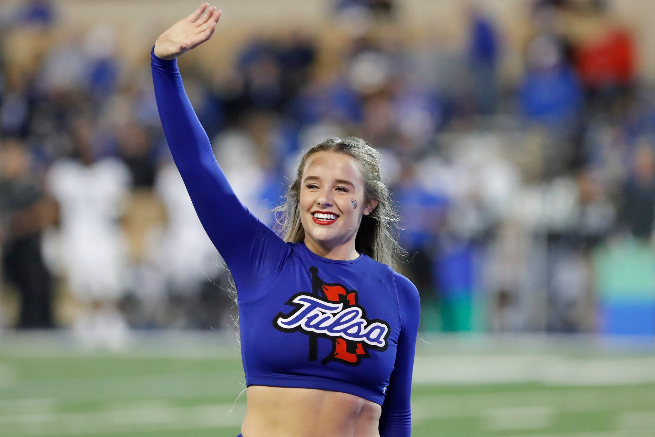 Oct 26, 2019; Tulsa, OK, USA; Tulsa Golden Hurricane cheerleader waves to fans during a time out in the second quarter against the Memphis Tigers at Skelly Field at H.A. Chapman Stadium. Mandatory Credit: Alonzo Adams-Imagn Images