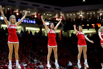 Jan 29, 2020; Albuquerque, New Mexico, USA;  The New Mexico State cheerleading squad perform during a timeout as the Lobos face the San Diego State Aztecs during the second half at Dreamstyle Arena. Mandatory Credit: Ivan Pierre Aguirre-Imagn Images