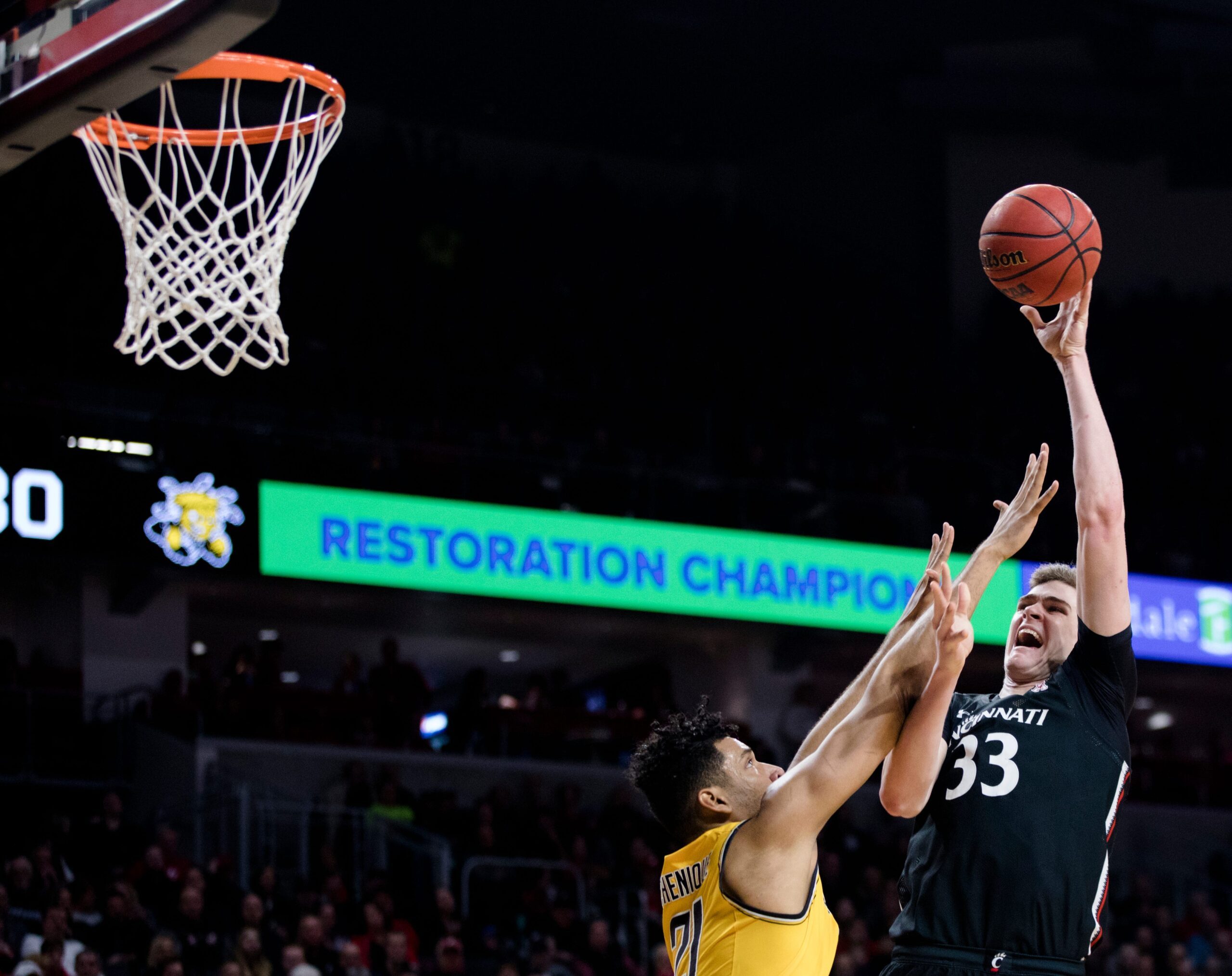 Cincinnati Bearcats center Chris Vogt (33) misses a shot over Wichita State Shockers center Jaime Echenique (21) in the second half of the NCAA men's basketball game on Sunday, Feb. 23, 2020, in Fifth Third Arena at the University of Cincinnati. Cincinnati Bearcats defeated Wichita State Shockers 67-64.

Cincinnati Bearcats Wichita State Shockers 243