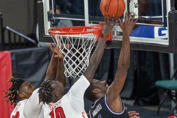 Marist Javon Cooley and Henry Makeny  try to block shot by Niagara Kobi Nwandu during first half action. Marist vs Niagara in MAAC men's basketball tournament quarterfinal game in Atlantic City on March 11, 2021.

Maacmarist210311c