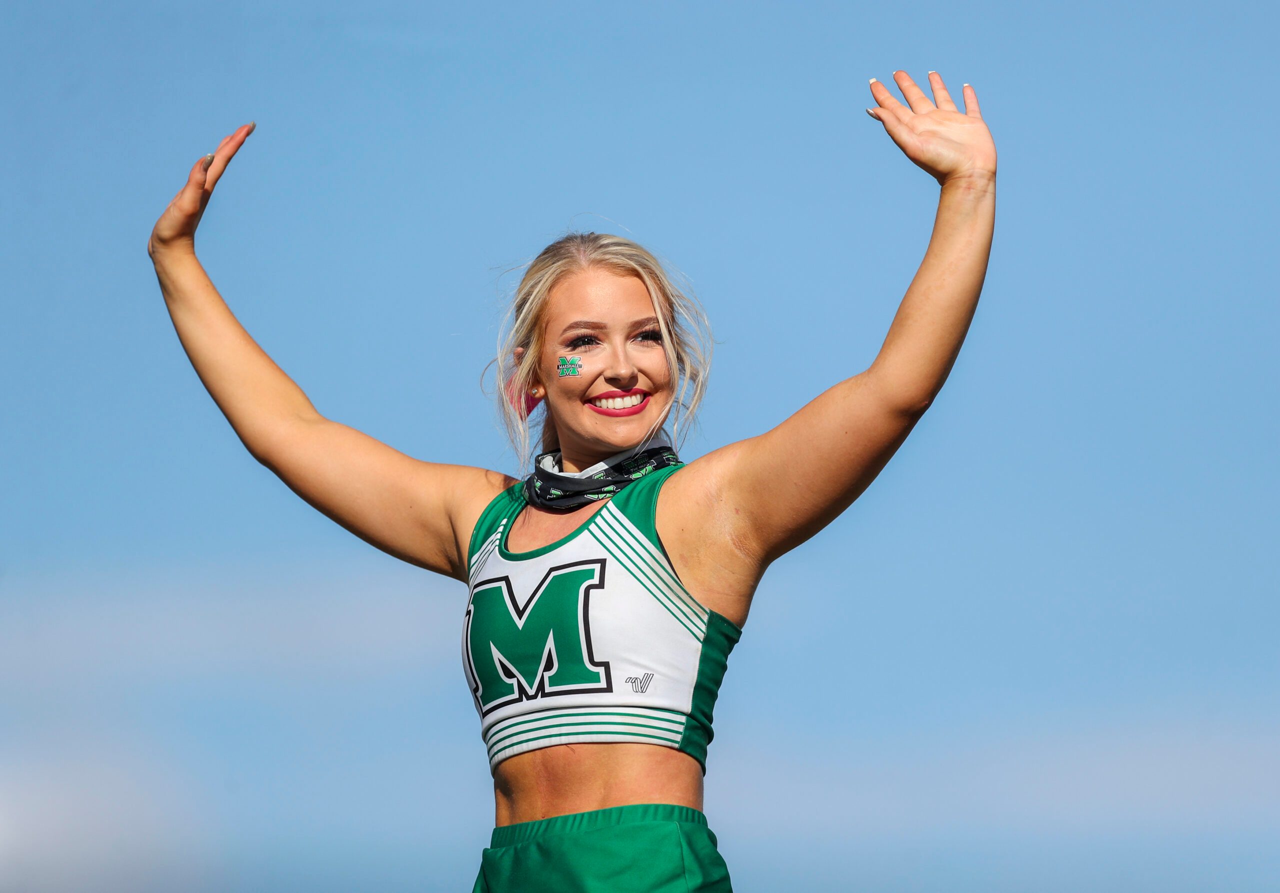 Oct 9, 2021; Huntington, West Virginia, USA; A Marshall Thundering Herd cheerleader performs during the third quarter against the Old Dominion Monarchs at Joan C. Edwards Stadium. Mandatory Credit: Ben Queen-Imagn Images