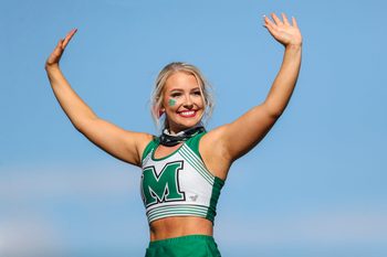 Oct 9, 2021; Huntington, West Virginia, USA; A Marshall Thundering Herd cheerleader performs during the third quarter against the Old Dominion Monarchs at Joan C. Edwards Stadium. Mandatory Credit: Ben Queen-Imagn Images