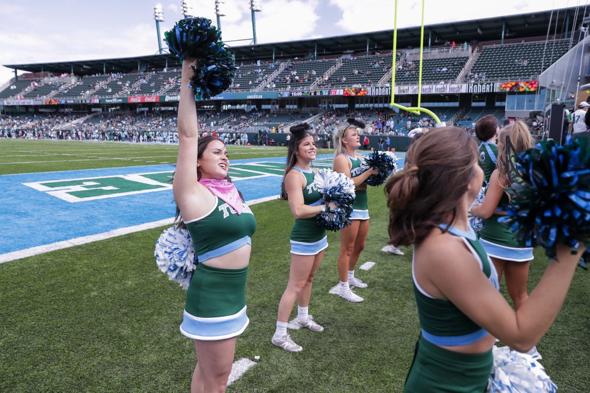 Oct 30, 2021; New Orleans, Louisiana, USA;  Tulane Green Wave cheerleaders entertain the fans against Cincinnati Bearcats during the second half at Yulman Stadium. Mandatory Credit: Stephen Lew-Imagn Images