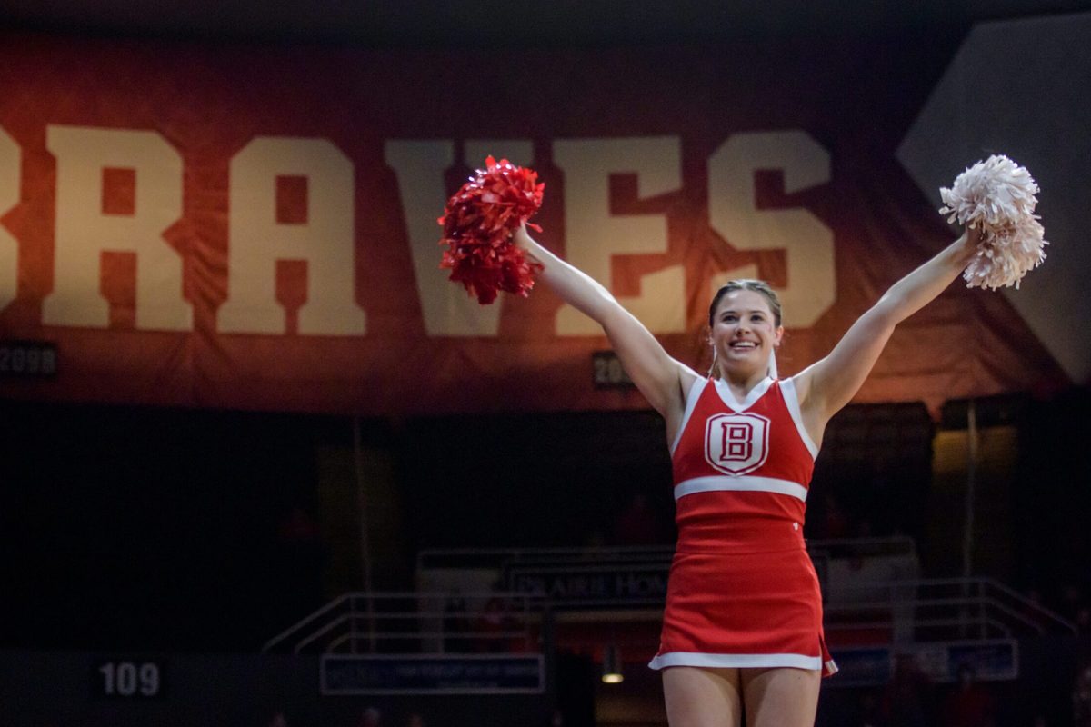 A Bradley Braves cheerleader raises her pompoms before the start of a game against Evansville on Wednesday, Jan. 12, 2022 at Carver Arena. The Braves defeated the Purple Aces 79-47.