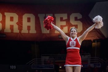 A Bradley Braves cheerleader raises her pompoms before the start of a game against Evansville on Wednesday, Jan. 12, 2022 at Carver Arena. The Braves defeated the Purple Aces 79-47.