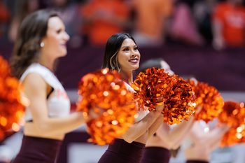 Feb 7, 2022; Blacksburg, Virginia, USA; Virginia Tech Hokies cheerleaders perform during the first half of an NCAA college basketball game against the Pittsburg Panthers at Cassell Coliseum. Mandatory Credit: Ryan Hunt-Imagn Images