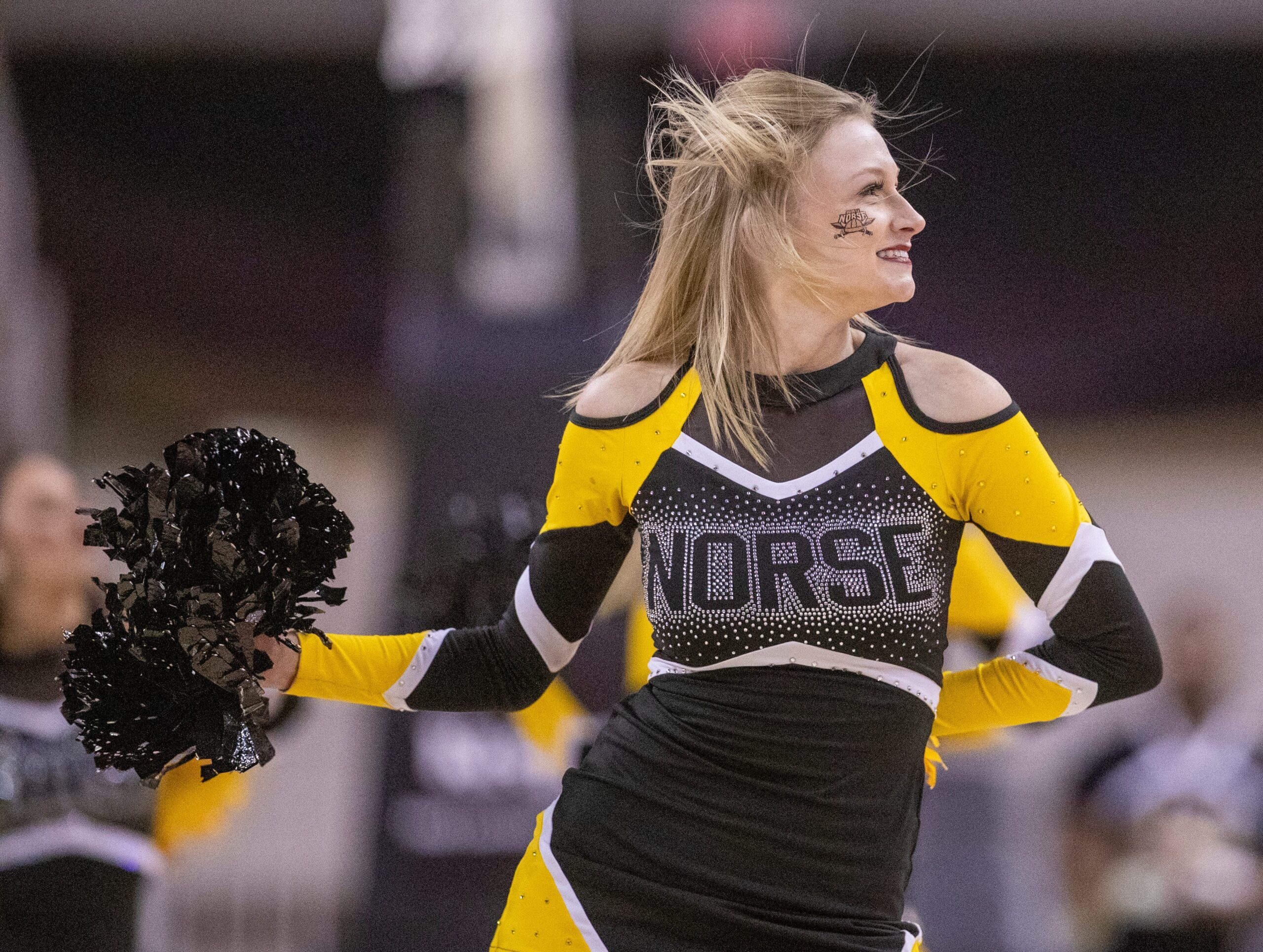 A Northern Kentucky Norse cheerleader works through a timeout, Monday, March 7, 2022, during Horizon League tournament men   s semifinal action from Indianapolis    Indiana Farmers Coliseum. NKU won 57-43.
