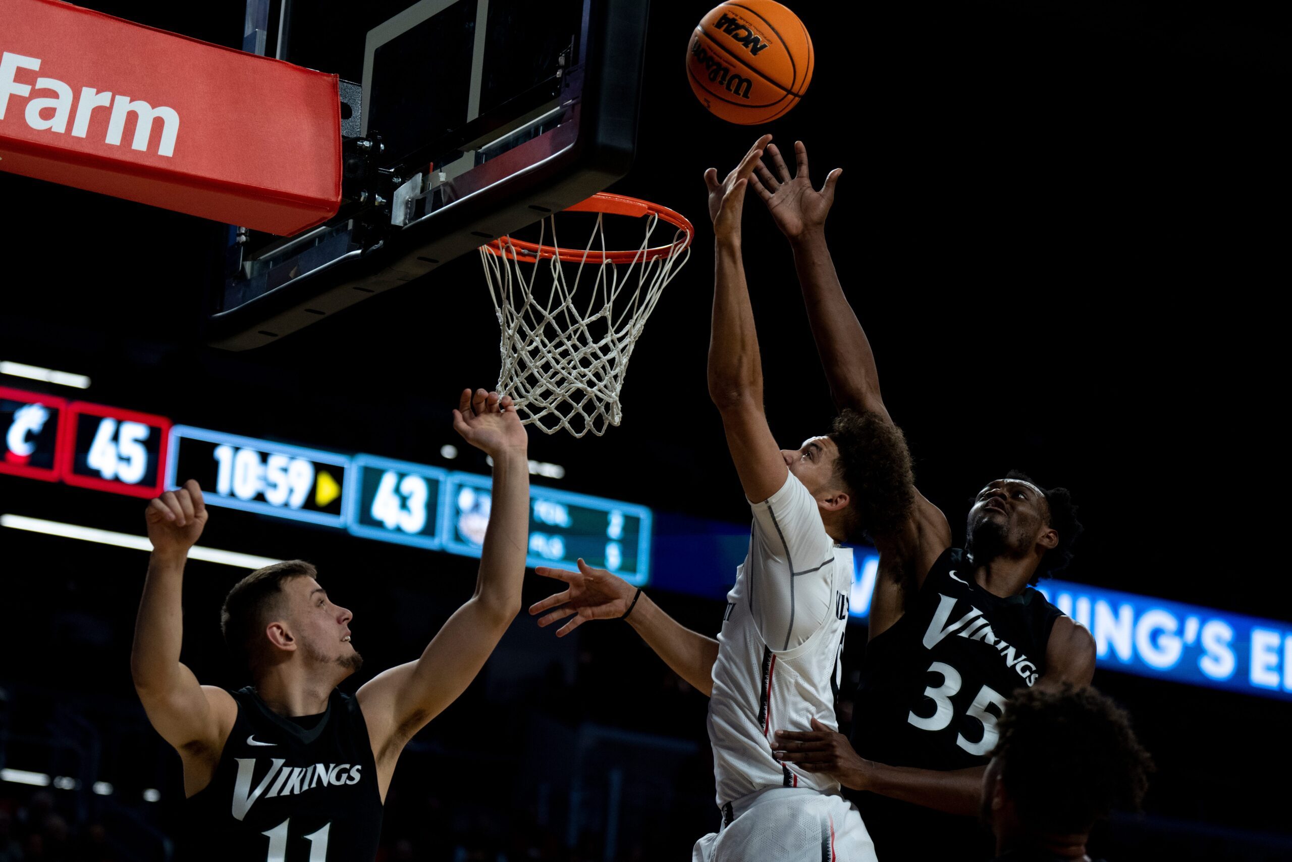 Cincinnati Bearcats guard Daniel Skillings (0) hits a shot over Cleveland State Vikings forward Jayson Woodrich (11) and Cleveland State Vikings forward Deante Johnson (35) in the second half of the men   s NCAA basketball game at Fifth Third Arena in Cincinnati on Thursday, Nov. 10, 2022. Cincinnati Bearcats defeated Cleveland State Vikings 69-58.

Cleveland State Vikings At Cincinnati Bearcats