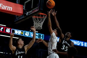 Cincinnati Bearcats guard Daniel Skillings (0) hits a shot over Cleveland State Vikings forward Jayson Woodrich (11) and Cleveland State Vikings forward Deante Johnson (35) in the second half of the men   s NCAA basketball game at Fifth Third Arena in Cincinnati on Thursday, Nov. 10, 2022. Cincinnati Bearcats defeated Cleveland State Vikings 69-58.

Cleveland State Vikings At Cincinnati Bearcats