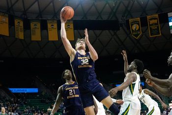 Nov 14, 2022; Waco, Texas, USA;  Northern Colorado Bears center Theo Hughes (32) shoots against Baylor Bears guard Adam Flagler (10) during the first half at Ferrell Center. Mandatory Credit: Chris Jones-Imagn Images