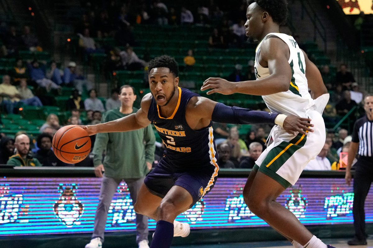 Nov 14, 2022; Waco, Texas, USA; Northern Colorado Bears guard Matt Johnson II (2) drives to the basket against Baylor Bears guard LJ Cryer (4) during the first half at Ferrell Center. Mandatory Credit: Chris Jones-Imagn Images