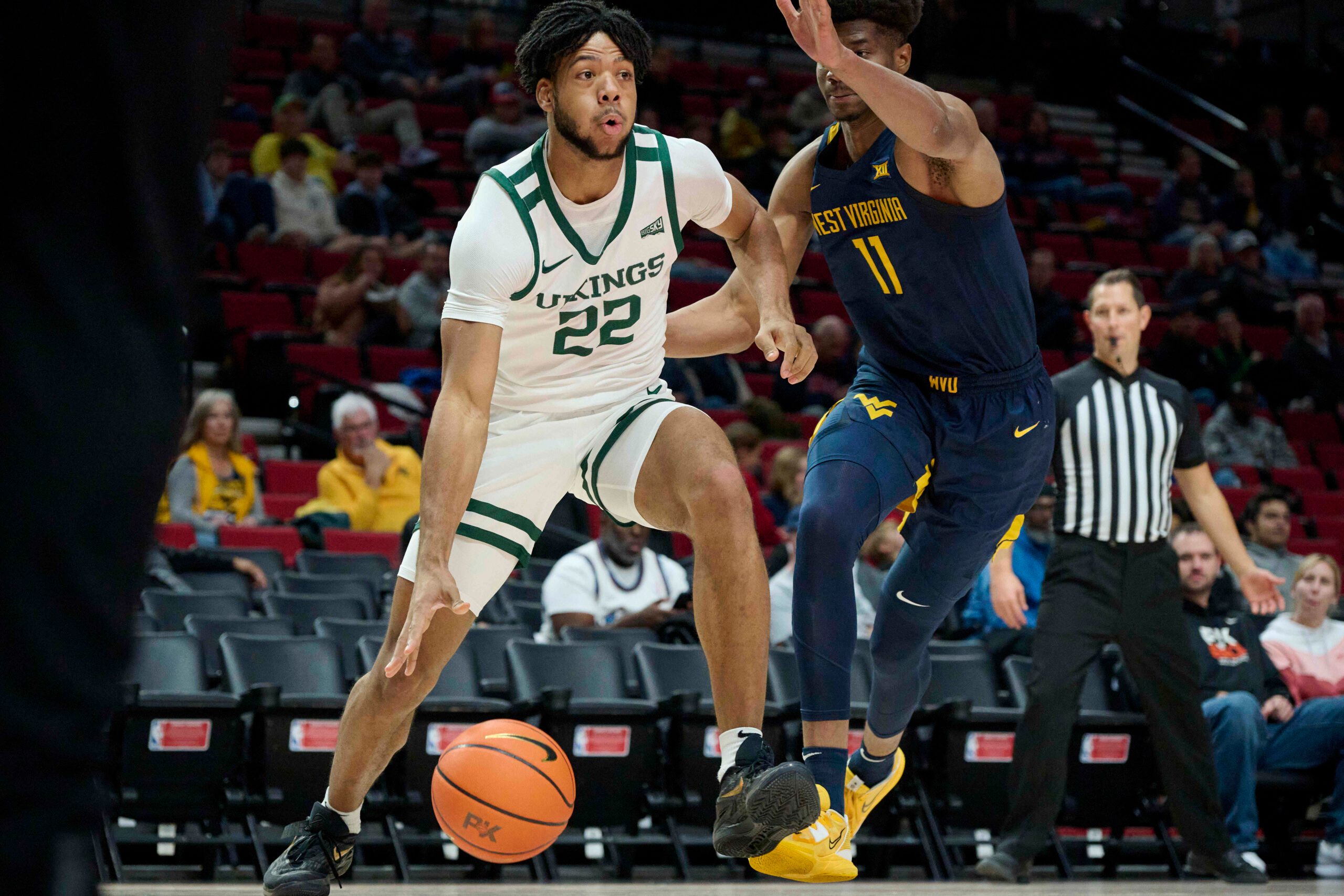 Nov 25, 2022; Portland, Oregon, USA;  Portland State Vikings forward Isaiah Johnson (22) drives to the basket during the first half against West Virginia Mountaineers forward Mohamed Wague (11) at Moda Center. Mandatory Credit: Troy Wayrynen-Imagn Images