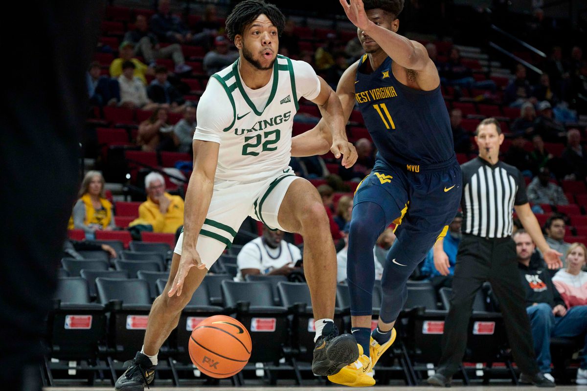 Nov 25, 2022; Portland, Oregon, USA;  Portland State Vikings forward Isaiah Johnson (22) drives to the basket during the first half against West Virginia Mountaineers forward Mohamed Wague (11) at Moda Center. Mandatory Credit: Troy Wayrynen-Imagn Images