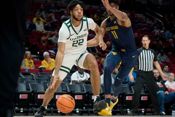 Nov 25, 2022; Portland, Oregon, USA;  Portland State Vikings forward Isaiah Johnson (22) drives to the basket during the first half against West Virginia Mountaineers forward Mohamed Wague (11) at Moda Center. Mandatory Credit: Troy Wayrynen-Imagn Images