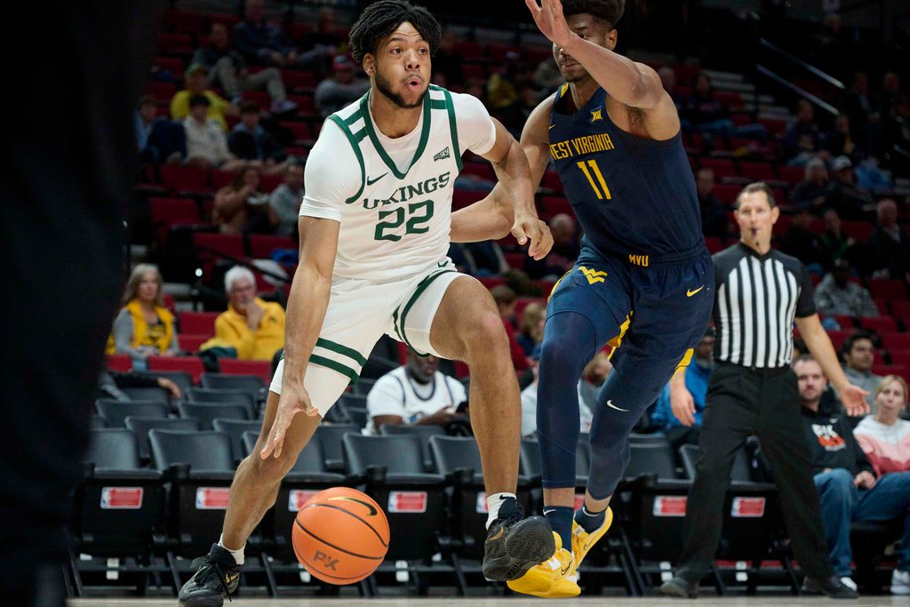 Nov 25, 2022; Portland, Oregon, USA; Portland State Vikings forward Isaiah Johnson (22) drives to the basket during the first half against West Virginia Mountaineers forward Mohamed Wague (11) at Moda Center. Mandatory Credit: Troy Wayrynen-Imagn Images