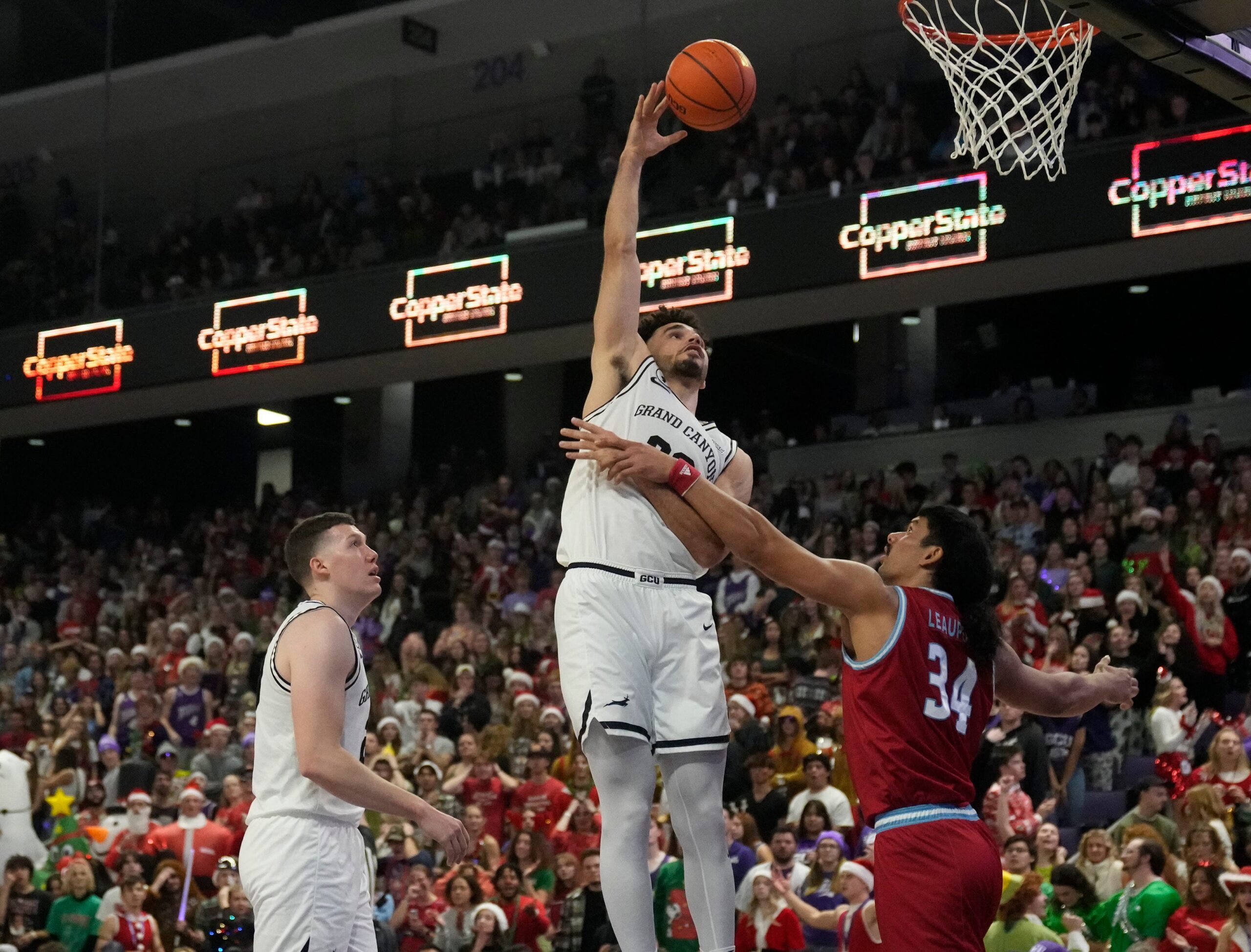 Dec 7, 2022; phoenix, Ariz., U.S.;  Grand Canyon Antelopes forward Gabe McGlothan (30) takes a shot while being guarded by Loyola Marymount Lions forward Keli Leaupepe (34) during a men  s basketball game at Grand Canyon University Arena. Mandatory Credit: Cheryl Evans-Arizona Republic

Ncaa Basketball Gcu Basketball Loyola Marymount At Grand Canyon
