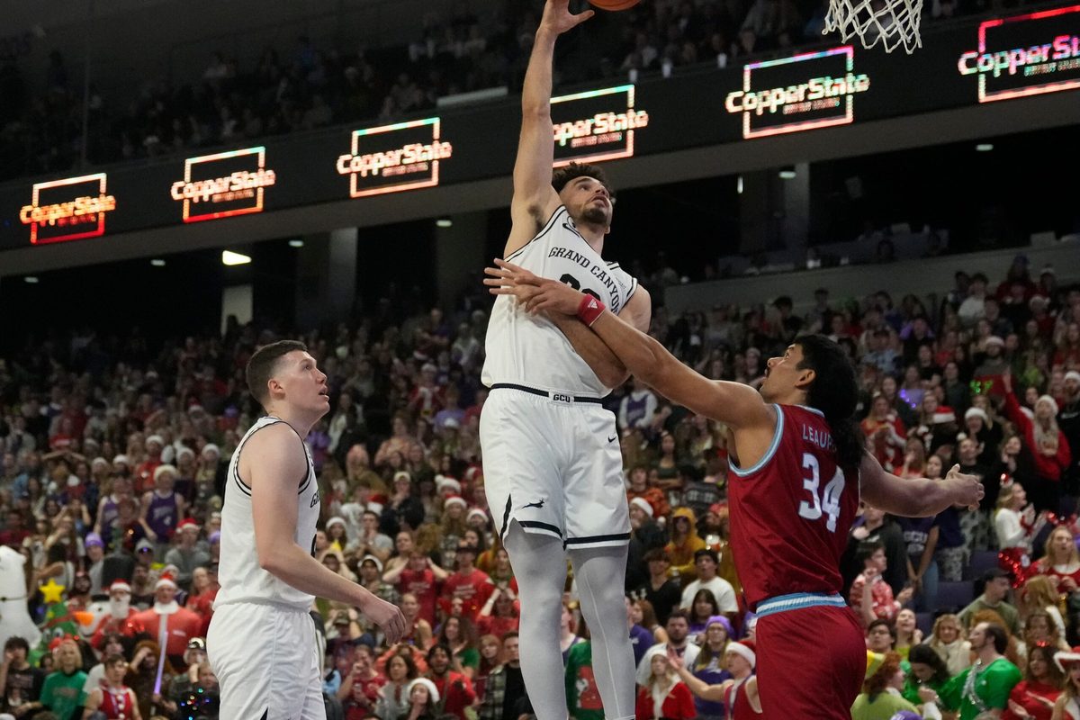 Dec 7, 2022; phoenix, Ariz., U.S.;  Grand Canyon Antelopes forward Gabe McGlothan (30) takes a shot while being guarded by Loyola Marymount Lions forward Keli Leaupepe (34) during a men  s basketball game at Grand Canyon University Arena. Mandatory Credit: Cheryl Evans-Arizona Republic

Ncaa Basketball Gcu Basketball Loyola Marymount At Grand Canyon