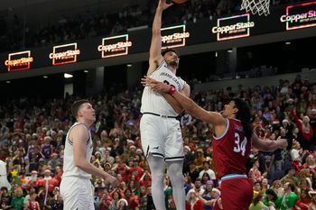 Dec 7, 2022; phoenix, Ariz., U.S.;  Grand Canyon Antelopes forward Gabe McGlothan (30) takes a shot while being guarded by Loyola Marymount Lions forward Keli Leaupepe (34) during a men  s basketball game at Grand Canyon University Arena. Mandatory Credit: Cheryl Evans-Arizona Republic

Ncaa Basketball Gcu Basketball Loyola Marymount At Grand Canyon