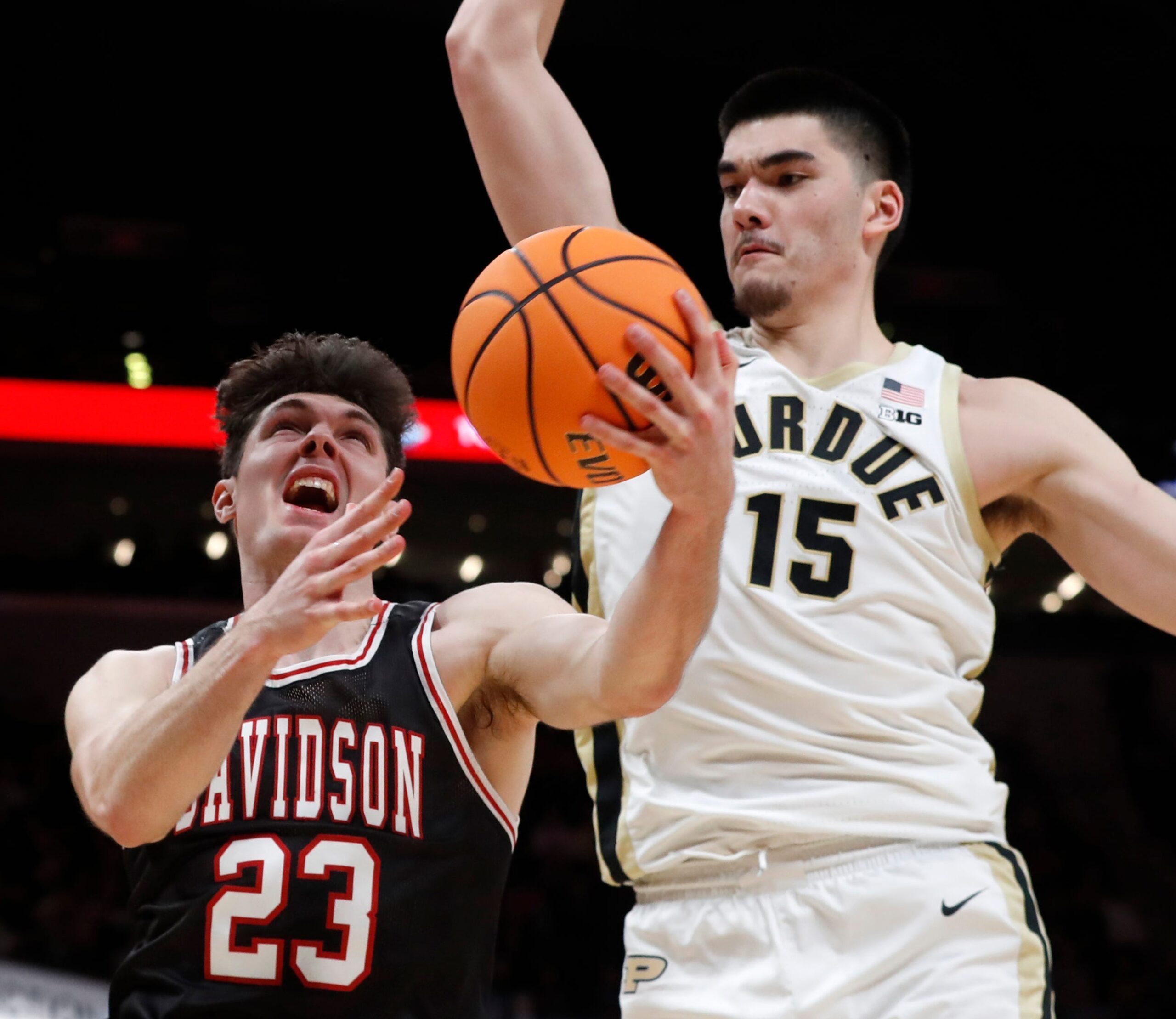 Purdue Boilermakers center Zach Edey (15) fouls Davidson Wildcats guard Connor Kochera (23) during the Indy Classic NCAA men s basketball doubleheader, Saturday, Dec. 17, 2022, at Gainbridge Fieldhouse in Indianapolis. Purdue won 69-61.
Purduedavidsonmbb121722 Am14258