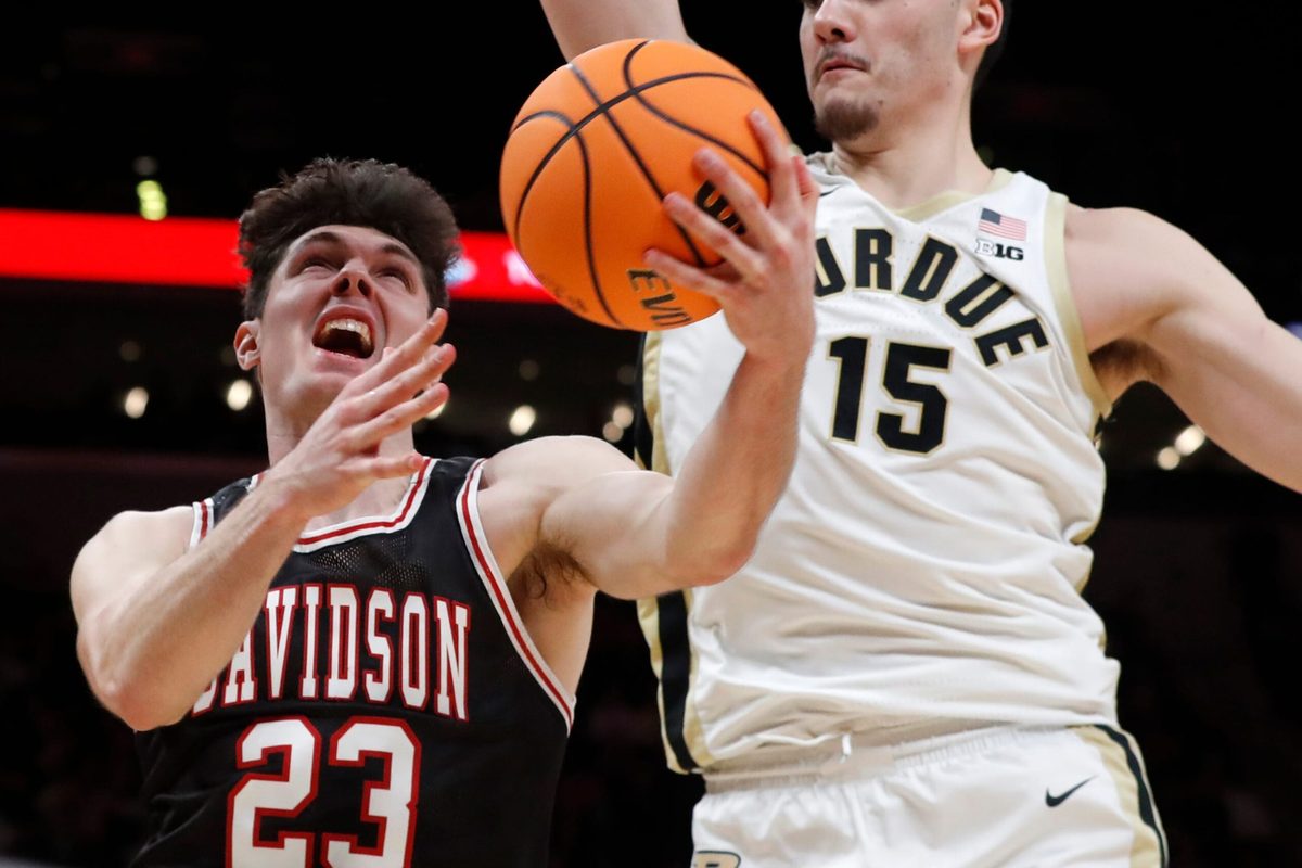 Purdue Boilermakers center Zach Edey (15) fouls Davidson Wildcats guard Connor Kochera (23) during the Indy Classic NCAA men   s basketball doubleheader, Saturday, Dec. 17, 2022, at Gainbridge Fieldhouse in Indianapolis. Purdue won 69-61.

Purduedavidsonmbb121722 Am14258