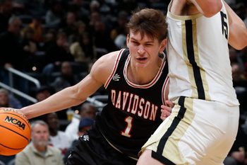 Davidson Wildcats guard Reed Bailey (1) drives to the basket during the Indy Classic NCAA men   s basketball doubleheader against the Purdue Boilermakers, Saturday, Dec. 17, 2022, at Gainbridge Fieldhouse in Indianapolis. Purdue won 69-61.

Purduedavidsonmbb121722 Am14040