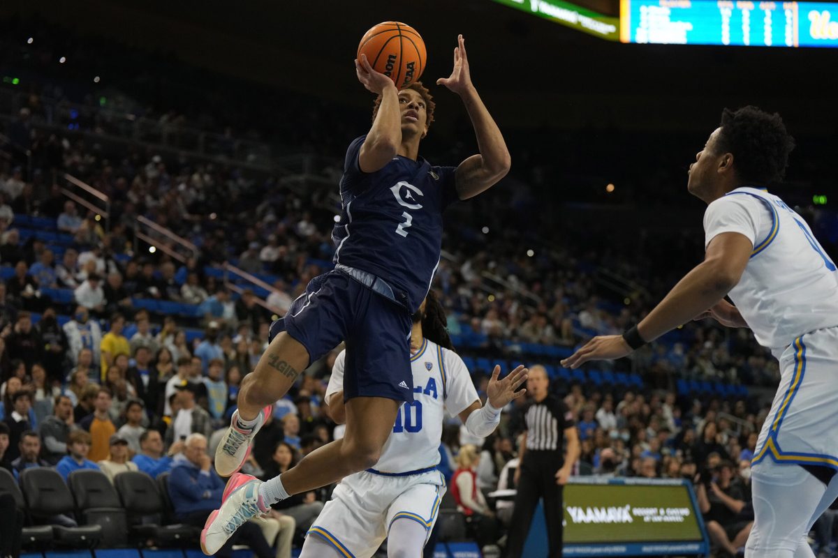 Dec 21, 2022; Los Angeles, California, USA; UC Davis Aggies guard Ty Johnson (2) shoots the ball against UCLA Bruins in the first half at Pauley Pavilion presented by Wescom. Mandatory Credit: Kirby Lee-Imagn Images