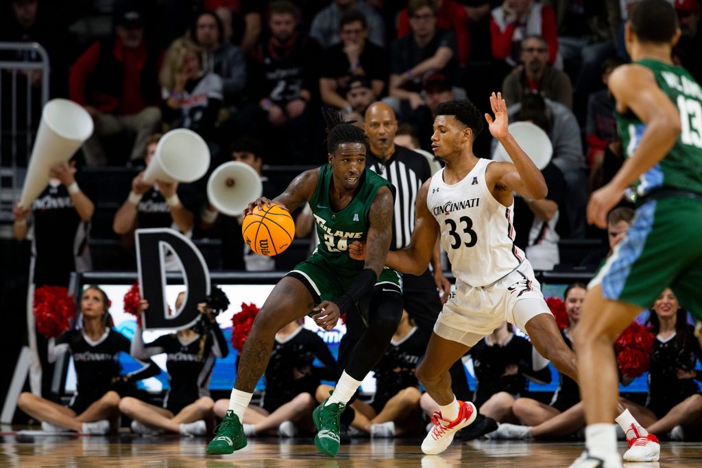 Cincinnati Bearcats forward Ody Oguama (33) guards Tulane Green Wave forward Kevin Cross (24) during the second half of an NCAA men s college basketball game on Thursday, Dec. 29, 2022, at Fifth Third Arena in Cincinnati. The Bearcats defeated the Green Wave 88-77 with a crowd of 9,484.
Tulane Green Wave At Cincinnati Bearcats Ncaa Basketball Dec 29