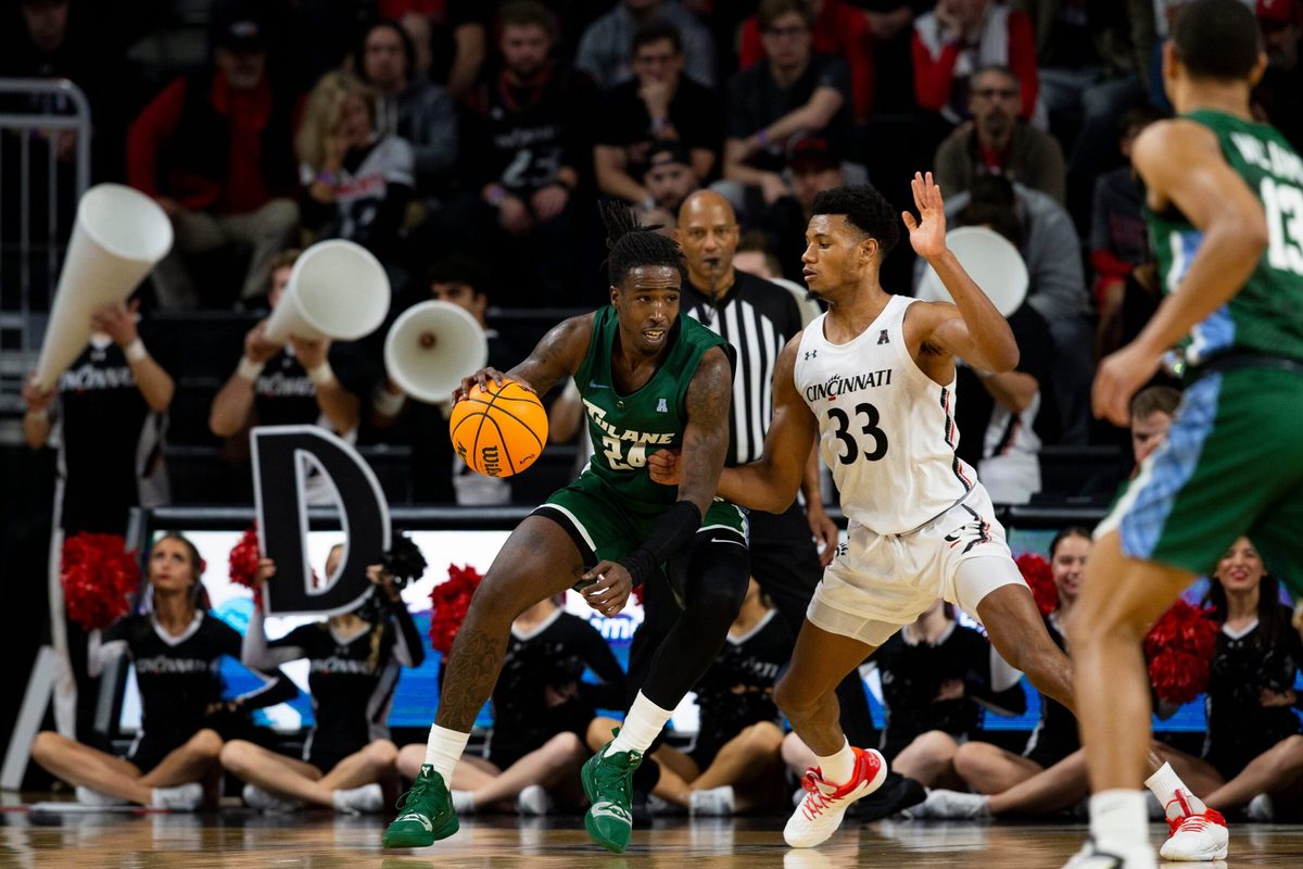 Cincinnati Bearcats forward Ody Oguama (33) guards Tulane Green Wave forward Kevin Cross (24) during the second half of an NCAA men s college basketball game on Thursday, Dec. 29, 2022, at Fifth Third Arena in Cincinnati. The Bearcats defeated the Green Wave 88-77 with a crowd of 9,484.
Tulane Green Wave At Cincinnati Bearcats Ncaa Basketball Dec 29
