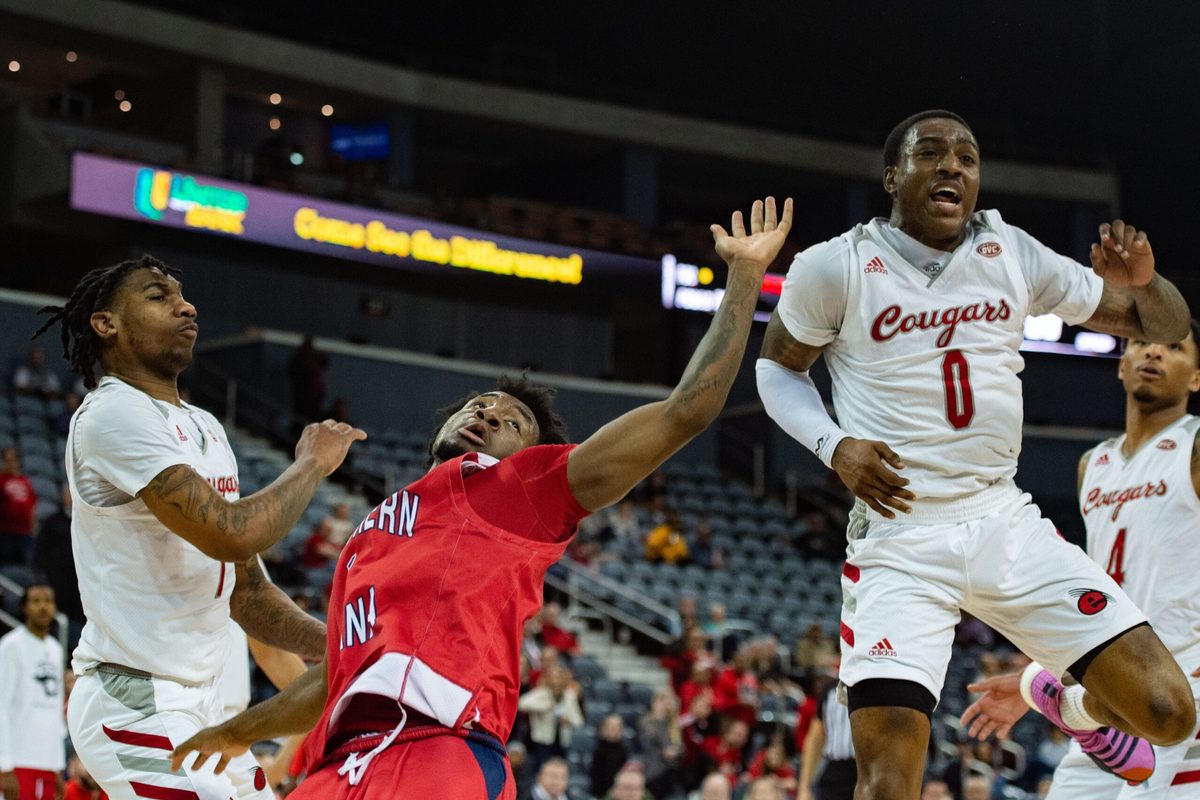 Southern Indiana   s Isaiah Swope (1) misses the rebound by as it   s caught by the Southern Illinois University Edwardsville Cougars during the Ohio Valley Conference on Wednesday night, March 1, 2023.

Usi Siue Ovc 030123 0895
