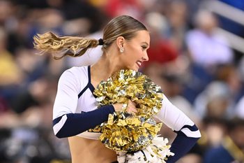 Mar 7, 2023; Greensboro, NC, USA; Georgia Tech Yellow Jackets cheerleader performs in the second half of the first round of the ACC Tournament at Greensboro Coliseum. Mandatory Credit: Bob Donnan-Imagn Images