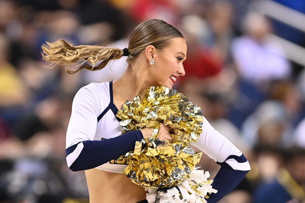 Mar 7, 2023; Greensboro, NC, USA; Georgia Tech Yellow Jackets cheerleader performs in the second half of the first round of the ACC Tournament at Greensboro Coliseum. Mandatory Credit: Bob Donnan-Imagn Images