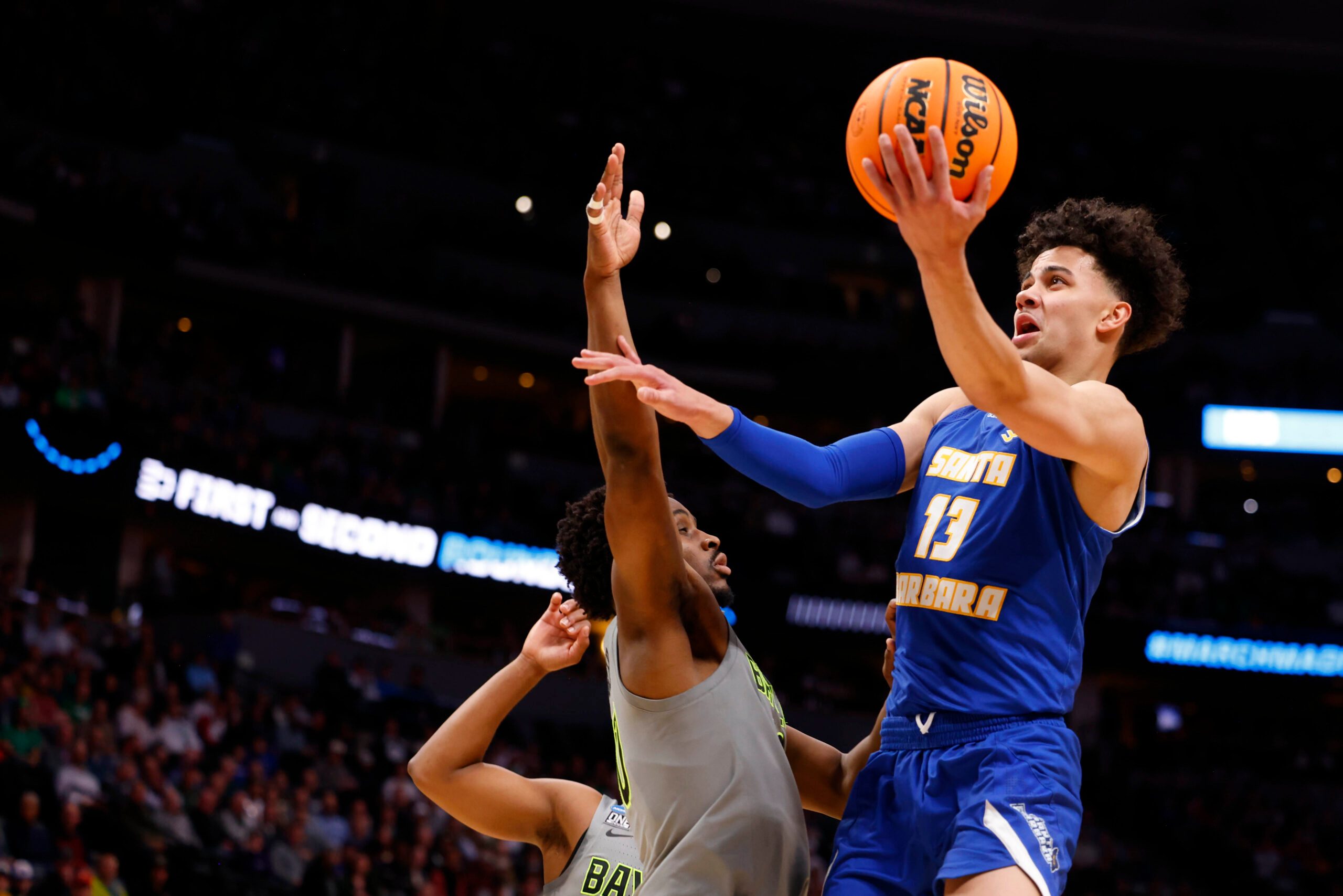 Mar 17, 2023; Denver, CO, USA;  UC Santa Barbara Gauchos guard Ajay Mitchell (13) drives to the basket against Baylor Bears during the first half in the first round of the 2023 NCAA men   s basketball tournament at Ball Arena. Mandatory Credit: Michael Ciaglo-Imagn Images