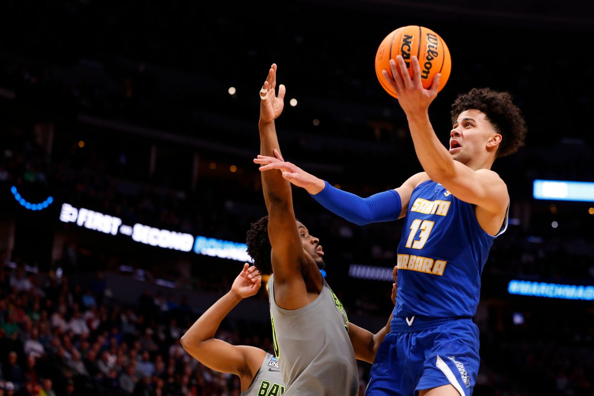 Mar 17, 2023; Denver, CO, USA;  UC Santa Barbara Gauchos guard Ajay Mitchell (13) drives to the basket against Baylor Bears during the first half in the first round of the 2023 NCAA men   s basketball tournament at Ball Arena. Mandatory Credit: Michael Ciaglo-Imagn Images