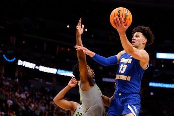 Mar 17, 2023; Denver, CO, USA;  UC Santa Barbara Gauchos guard Ajay Mitchell (13) drives to the basket against Baylor Bears during the first half in the first round of the 2023 NCAA men   s basketball tournament at Ball Arena. Mandatory Credit: Michael Ciaglo-Imagn Images