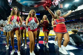 Apr 1, 2023; Houston, TX, USA; Florida Atlantic Owls cheerleaders perform in the semifinals of the Final Four of the 2023 NCAA Tournament against the San Diego State Aztecs at NRG Stadium. Mandatory Credit: Robert Deutsch-Imagn Images