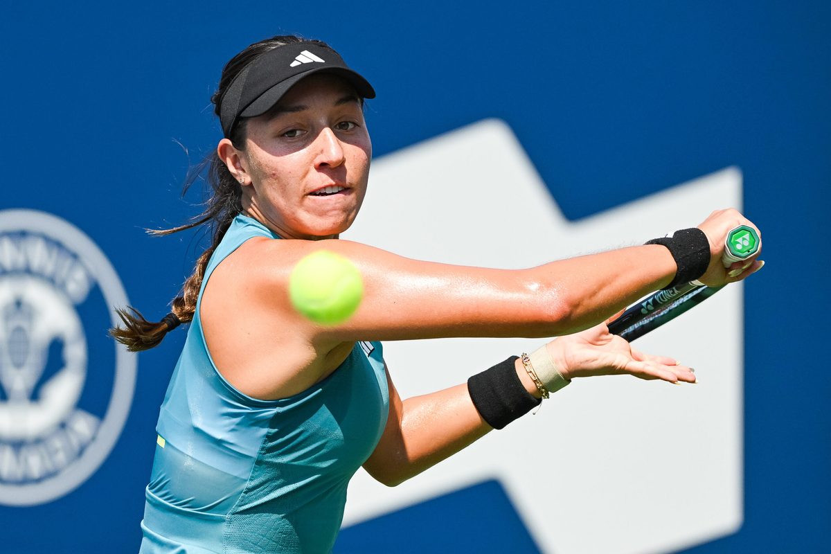 Aug 10, 2023; Montreal, Quebec, Canada; Jessica Pegula (USA) returns the ball to Jasmine Paolini (ITA) (not pictured) during third round play at IGA Stadium. Mandatory Credit: David Kirouac-Imagn Images