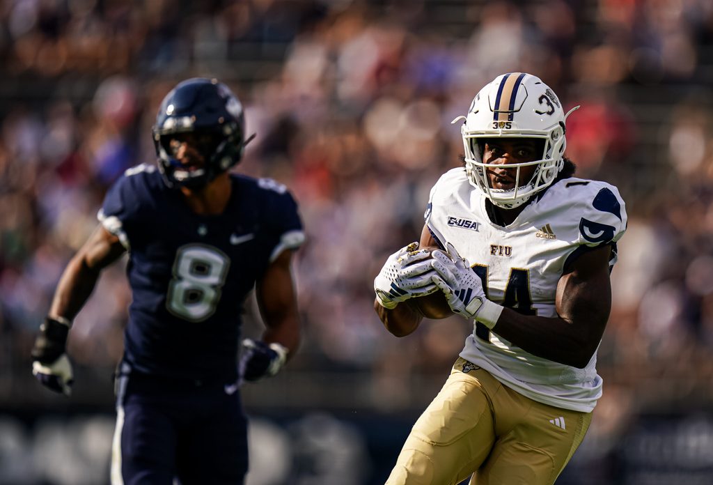 Sep 16, 2023; East Hartford, Connecticut, USA; FIU Golden Panthers wide receiver Jalen Bracey (14) makes the catch and runs the ball for a touchdown against the UConn Huskies in the second quarter at Rentschler Field at Pratt & Whitney Stadium. Mandatory Credit: David Butler II-Imagn Images