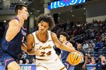 Nov 8, 2023; Chicago, Illinois, USA; Florida Atlantic Owls center Vladislav Goldin (50) defends Loyola Ramblers center Miles Rubin (24) during the first half at Wintrust Arena. Mandatory Credit: David Banks-Imagn Images