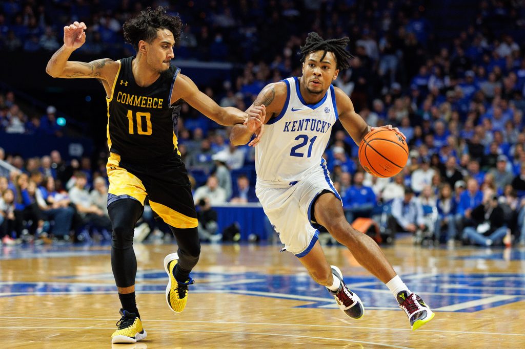 Nov 10, 2023; Lexington, Kentucky, USA; Kentucky Wildcats guard D.J. Wagner (21) drives to the basket against Texas A&M Commerce Lions guard Alonzo Dodd (10) during the second half at Rupp Arena at Central Bank Center. Mandatory Credit: Jordan Prather-Imagn Images