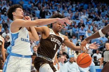 Nov 12, 2023; Chapel Hill, North Carolina, USA; North Carolina Tar Heels forward Zayden High (1) and Lehigh Mountain Hawks guard Nasir Whitlock (1) fight for the ball in the second half at Dean E. Smith Center. Mandatory Credit: Bob Donnan-Imagn Images