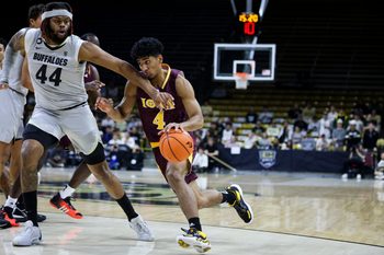 Nov 26, 2023; Boulder, Colorado, USA; Iona Gaels guard Jean Aranguren (4) drives past Colorado Buffaloes center Eddie Lampkin Jr. (44) in the first half at CU Events Center. Mandatory Credit: Chet Strange-Imagn Images