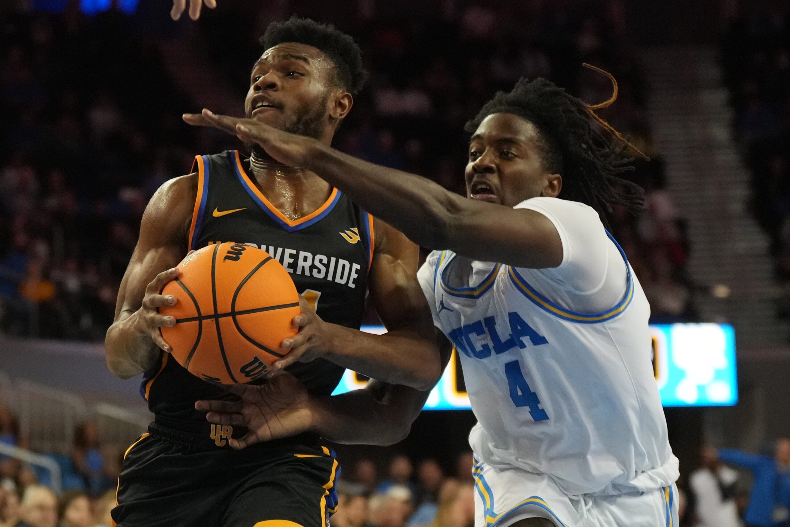 Nov 30, 2023; Los Angeles, California, USA; UC Riverside Highlanders guard Barrington Hargress (24) shoots the ball against UCLA Bruins guard Will McClendon (4) in the first half at Pauley Pavilion presented by Wescom. Mandatory Credit: Kirby Lee-Imagn Images