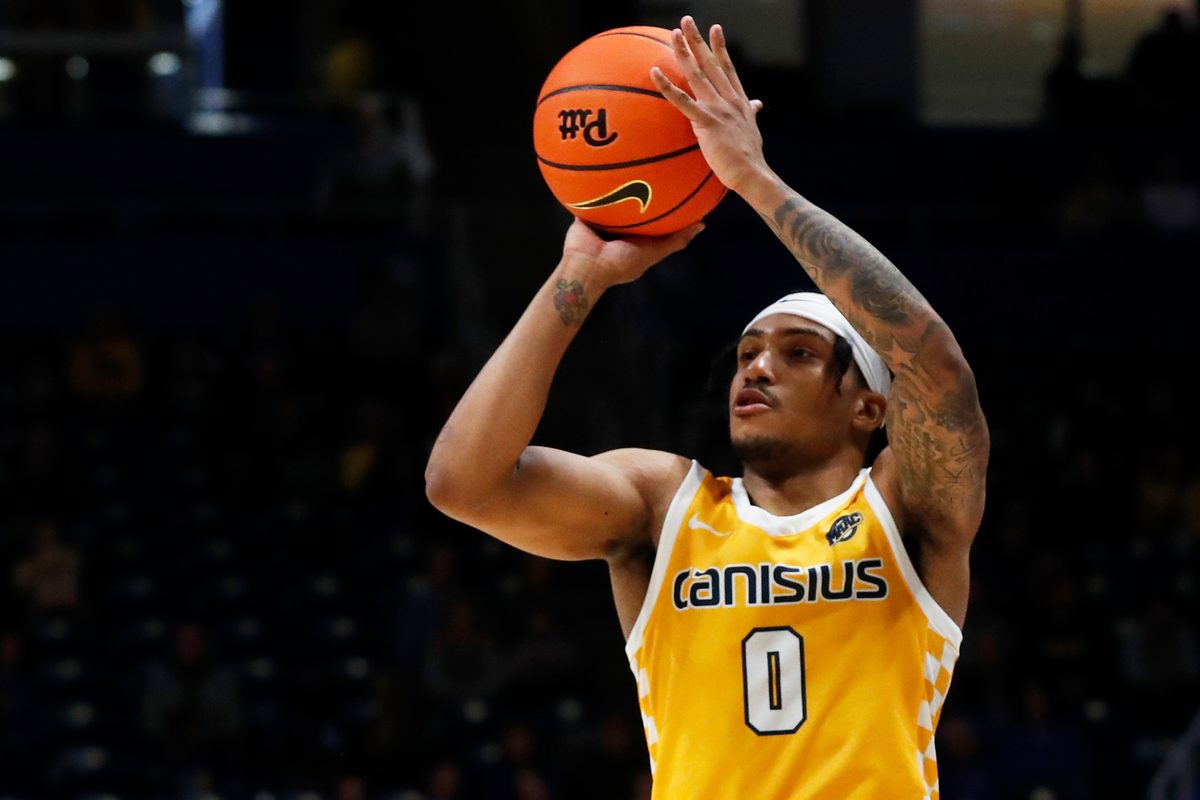Dec 9, 2023; Pittsburgh, Pennsylvania, USA;  Canisius Golden Griffins guard Tre Dinkins (0) shoots against the Pittsburgh Panthers during the second half at the Petersen Events Center. Pittsburgh won 82-71. Mandatory Credit: Charles LeClaire-Imagn Images