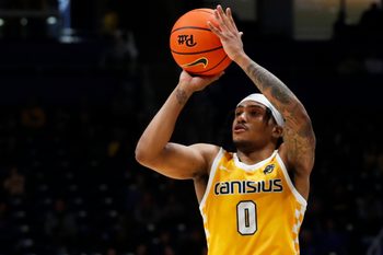 Dec 9, 2023; Pittsburgh, Pennsylvania, USA;  Canisius Golden Griffins guard Tre Dinkins (0) shoots against the Pittsburgh Panthers during the second half at the Petersen Events Center. Pittsburgh won 82-71. Mandatory Credit: Charles LeClaire-Imagn Images